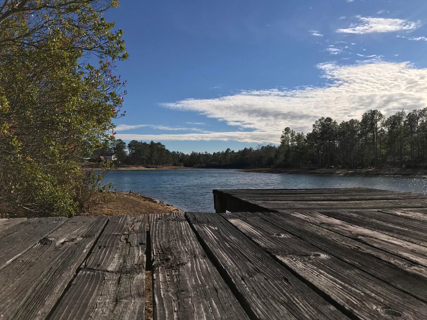 Build your lakefront dream home on this beautiful property. Nearly 2 acres of privacy on Mirror Lake just east of Crestview. Enjoy country living and be just minutes from town. Enjoy fishing and ''quiet'' boating on this beautiful lakefront property. There's already a dock in place so you can't start fishing right away. Put this on your list of ''must see'' properties.