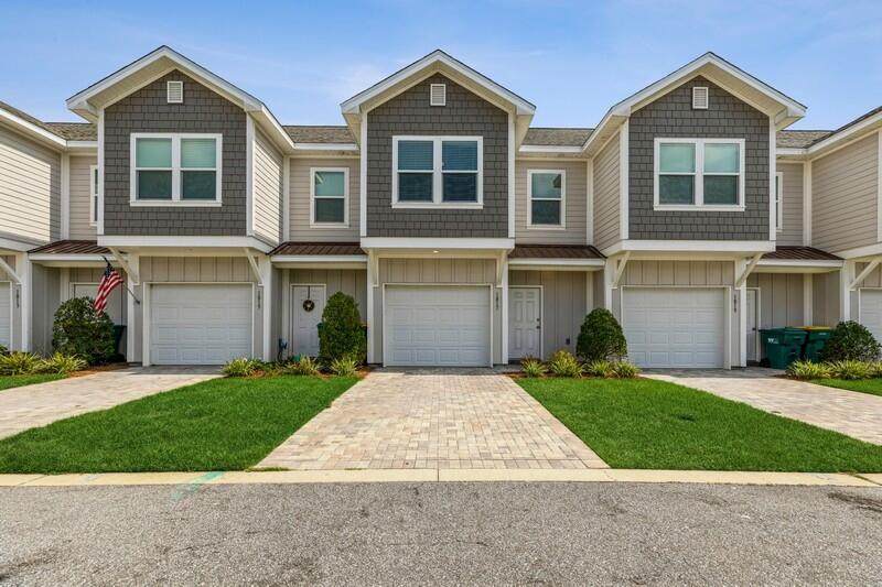 Lucky you! If you missed your chance to buy one of these luxury townhomes in 2021, when they were built, here it is. This two-story gem features an open concept floorplan with high-end finishes, including 4.25'' crown molding and baseboards throughout the home. Lofty 9' ceilings on all floors, with a 12' vaulted ceiling in the Master Suite. A kitchen fully-equipped with stainless steel, Energy Star rated appliances, gorgeous 42'' wood cabinetry with granite counters and a tile backsplash you will absolutely love. There is a custom-built buffet just off the kitchen that would be a great coffee bar.The granite breakfast bar connects the kitchen to the dining and living space, prewired for today's internet and cable needs. A powder room, storage, and the garage complete the first floor The soft pallet throughout the home is modern and still brings a bit of that laid-back coastal feel with added details such as a shiplap wall in the living room, echoed under the breakfast bar. Upstairs are the two spacious guest bedrooms, a full bath with tub, the laundry closet (washer/dryer included), and the Master Suite. The Master suite has a 12' vaulted ceiling, a huge walk-in closet and a luxurious bath with double vanity, and walk-in tile shower with rainhead and a separate handheld.
Save $$$$$ - This home has many energy saving features, including: a HVAC system in a 14 SEER energy efficient Heat Pump with programmable thermostats; R-13 exterior wall insulation and R-38 blown ceiling insulation; low E single hung, double insulated windows; low energy LED lighting; and more.
Stable Lanes is 32-unit complex centrally located between Eglin AFB and Hurlburt AFB, right by the back entrance of Fort Walton Beach Medical Center too! Northwest Florida State College is also a quick drive away. So centrally located to everything that Fort Walton Beach has to offer! This would make a great home and or a great long-term investment!
Professional Photos coming soon!