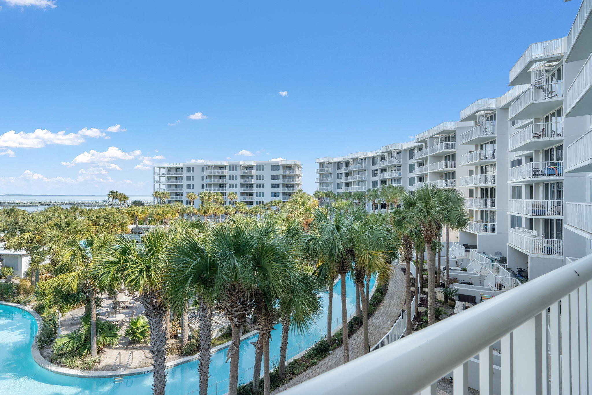 Amazing CORNER UNIT investment opportunity! Well kept and highly booked rentals non stop! This amazing corner unit gets an abundance of natural lighting on the coastal setup. Views of the pool and Soundside are so dreamy! No wonder this is the best 6 person rental on the market. You have a spacious primary retreat and then down the hall, you will notice double bunks for 2 more kiddos/ teens. Another full bathroom so you don't have to share with anyone either. Washer/dryer, other appliances and furniture/decorations are to convey. This is a turn key rental that is ready for your new investment to take over. Bookings may limit the showing process so please book your private tour in advance to have the time to soak in the beauty and sunshine from the balcony!