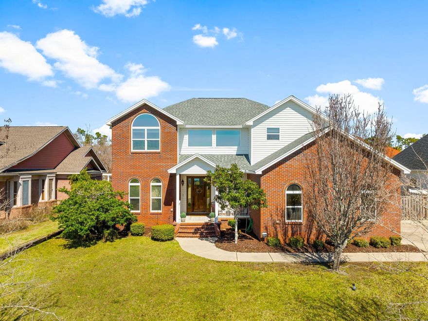 This stunning brick home is nestled in a well-established neighborhood, with underground utilities, and water views offering timeless charm and modern elegance. Inside, Beautiful wood floors,  spacious inviting living spaces. The spacious gourmet kitchen is a chef's dream, with custom cabinets, quartz counter tops and high-end appliances, ample counter space, and stylish finishes. Step outside to your own private retreat--an inviting backyard oasis complete with a sparkling saltwater pool - Spa and a dedicated grill area, with stunning 14x28 screened-in patio designed for morning coffee and evening entertaining or unwinding in style. This home is the perfect blend of comfort, sophistication, and convenience!