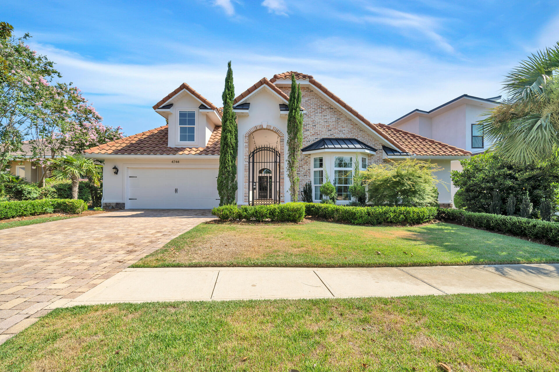 Well maintained, walk to the beach or restaurants, gated community and room for multiple families makes this custom contemporary beach house the perfect rental or home. Welcome to 4744 Papaya Park, a beautiful move-in ready home in the gated community of Destiny East. The unique open layout of the residence features an entry courtyard leading both to the front door and a separate entrance to a semi-private attached guest suite with morning kitchen and private bath. Walking through the front door you are greeted with wood floors, a gas fireplace flanked by additional built-in cabinets that lead your eye through the outdoor living to the pool and lush private backyard.View Full Video:https://vimeo.com/724019414