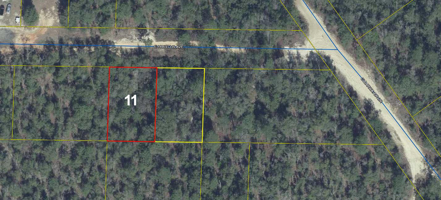 Wooded lot with limited access and available utilities. The lot is best suited for being 'off the grid'.