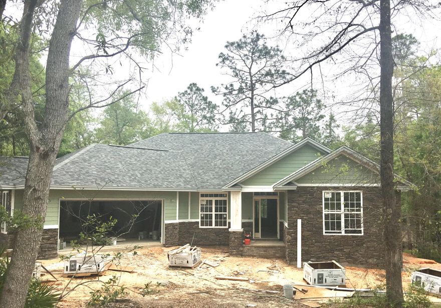 Come out and see this one of a kind custom New Construction home built by an Award Winning builder. This home is perfectly situated on this beautiful treed lot. The stack stone and cement board siding adds a ton of curb appeal. This floor plan is very open with so much natural light. The four bedrooms are large with big closets with three full bathrooms. The finishes in this home are upgraded. The trim work beautifully adds to the custom feel of the home. The enormous island is covered in granite. The master bedroom includes his and hers closets and the master bath has a huge open shower, soaking tub, and double vanity. You will be able to sit on the covered back patio and enjoy this over half acre lot. Location is close to Duke field and Eglin Airforce Base.