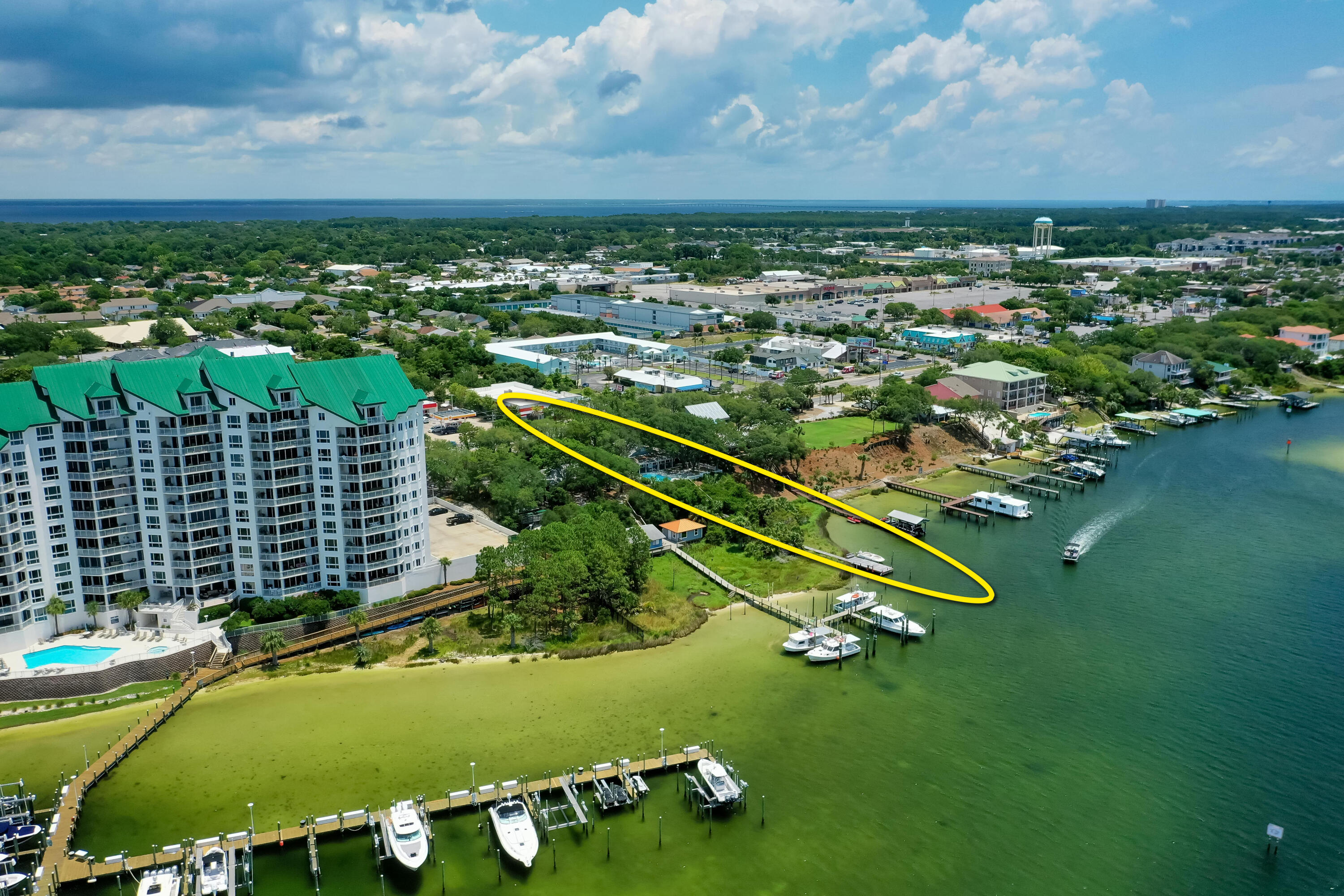 Welcome to 702 Harbor Boulevard, a legendary property graced by moss-filled, gorgeous Southern Oaks, and expanding over .50 acres on a high bluff overlooking the Scenic Harbor of Destin, Florida!Never listed in its history, this generational home is a quintessential homestead now available for a new family to enjoy as a coastal retreat. The home features gorgeous Heart Pine, high ceilings, separate guest cottage, and a pool with a stunning view corridor across the harbor. This fabulous property contains 121' on the deep-water of the harbor, thus offering deep-water boat slips with the capability of mooring large vessels in the virtual wildlife sanctuary of this estate's backyard. The infrequent offering of such a unique, charming property makes this listing extremely...
