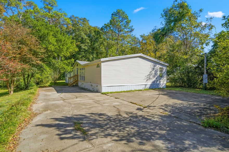 Beautifully Renovated 5-Bedroom Manufactured HomeThis spacious 5-bedroom, 3-bath home has been completely renovated and is conveniently located near shopping, dining, and other local establishments. Inside, you'll find modern LVP flooring throughout, a stylish kitchen featuring wood countertops and cabinets, and an open-concept living area with high ceilings that create a bright, airy feel. Perfect for families or anyone looking for plenty of space and comfort!Seller financing available