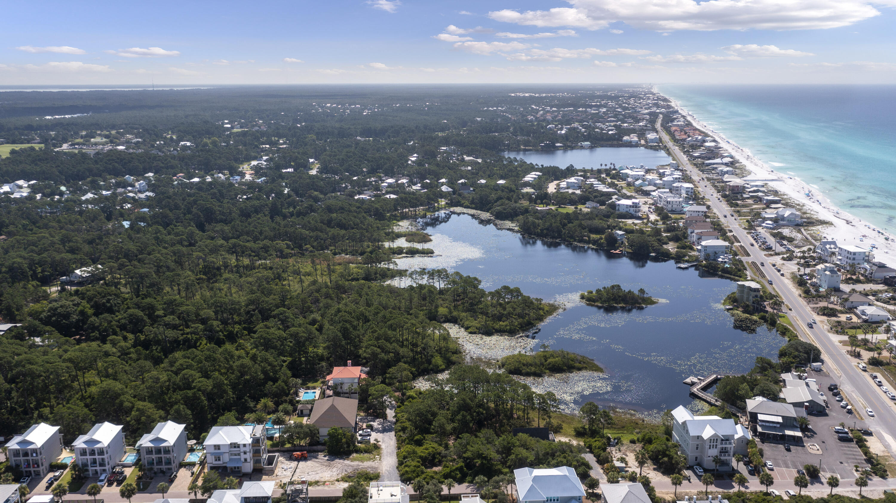 One of the Largest lots for sale on 30a. This Half Acre lot situated on a rare coastal  dune lake, makes it  perfect for a family residence or an one of a kind rental. With an easy walk down the street to the beautiful white sand beaches of the emerald coast or one of the best restaurants on 30a.This lot is suitable for a 7000 sq ft single story buildable area.  Seller has plans for a 5100 sq ft  with a  pool and pool house with builder cost ready to go. please call for information on that.  Plans and professional designer selections can be provided to the new buyer. You will have a hard time finding a better lot to build your DREAM HOUSE on. Call today for more information.