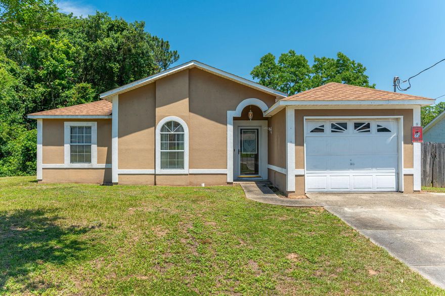 FRAME THIS ADDRESS! Picturesque 3 bedroom 2 bath is conveniently located! THIS PRICE INCLUDES NEW ROOF TO BE INSTALLED BEFORE CLOSING & $6,000 BUYERS CLOSING COSTS!!!  Spacious living area with tile and laminate throughout. Eat-in kitchen, ample cabinets and pantry.  Bedrooms are laminate flooring, Master bath boasts beautiful tile walk-in shower.  Large deck off the back is perfect for entertaining.   Home at last!