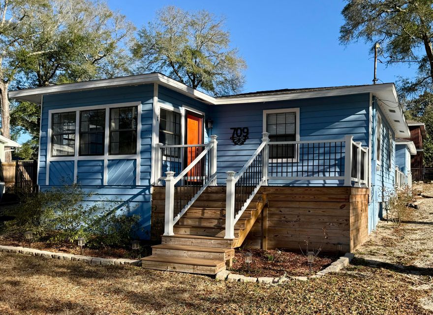 Welcome to this charming Florida-style cottage located in the heart of Niceville, convenient to Eglin AFB, local shopping, dining, parks, and schools. This 3-bedroom, 2-bath home features a split floor plan, an updated kitchen with granite countertops and stainless steel appliances, and a spacious primary suite with a private bath, granite surfaces, and a walk-in closet. Interior updates include fresh paint throughout and new carpet in all bedrooms, creating a clean, move-in-ready feel.Outdoor living is enhanced by both front and back decks upgraded with durable Trex boards, offering a peaceful oasis after a long day. There is a gravel RV pad complete with electrical and sewer hookups. The detached one-car garage offers flexible use for parking, storage, or a workshop. The yard features established sod and a WiFi-enabled irrigation system for convenient maintenance. Additional highlights include a roof installed in May 2021 and consistent termite and pest prevention.