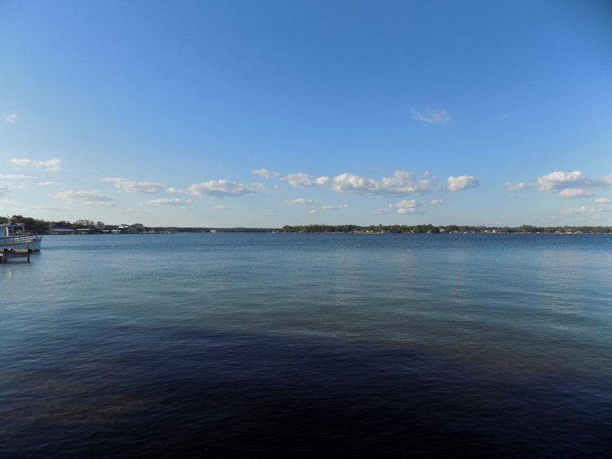 Incredible Water front views from every floor. If you want waterfront living-THIS IS WHAT YOU WANT. DEEP WATER BOAT SLIP INCLUDED. At Bayou PInes there are only 15 secluded town homes with private balconies, 2 docks & 16 boat slips large enough for a 30' boat. Enjoy an evening boat ride to waterfront dining, fishing or just relaxing on your balcony with a view of Garniers Bayou. This home has rich maple cabinets with granite counters and stainless steel appliances that open up the living and dining rooms all with views of the water. The first floor has a large room that can be a master bedroom or media room with built in wall cabinets and a full bath. Two additional bedrooms one being the second master bedroom are on the third floor each with their own bathrooms.