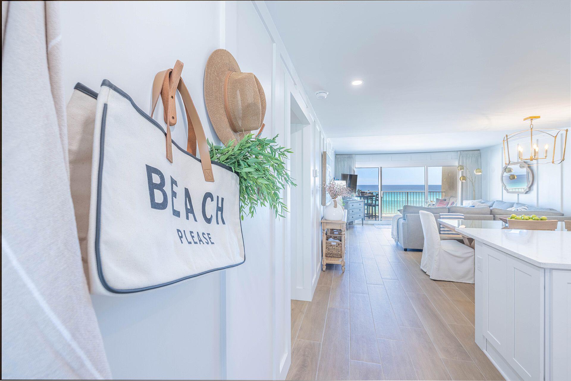 Southern Magnolia offers an unparalleled gulf-front living experience at Beach House Condominium in Miramar Beach. This fully reimagined two-bedroom, two-bath condo is a design masterpiece, completely transformed from the studs to create an open, flowing floor plan unlike any other in the building. Every inch of the 1,017 square feet has been meticulously curated with high-end finishes and thoughtful details, from custom tile work and board-and-batten walls to hidden storage solutions and premium furnishings. The gourmet kitchen is the heart of the home, boasting stainless steel appliances, a built-in microwave drawer, an under-counter ice maker for beach days, floating shelves and abundant counter space. A built-in pantry features a dedicated charging station, while custom window treatments and durable tile flooring flow seamlessly throughout. The guest suite comfortably sleeps six with built-in bunks and a queen bed, while the spa-inspired bathrooms elevate the every day with bespoke design elements like a hidden step stool for little ones. Step outside onto the oversized balcony, where a full-sized polywood sofa and dining table offer a front-row seat to breathtaking gulf views. With its private 650 feet of pristine beachfront, Beach House Condominium ensures exclusivity and serenity, even during peak seasons. Amenities include a beachfront pool, kids' pool, fitness center, tennis courts, a shuffleboard court and a covered pavilion with new gas grills. Beach service is included for ultimate convenience, and a special assessment for building updates, including waterproofing and fresh paint, has already been paid in full. Whether you're looking for a family-friendly retreat or a smart rental investment, Southern Magnolia is a one-of-a-kind opportunity to enjoy the beauty and tranquility of beachfront living. This is coastal elegance redefined.