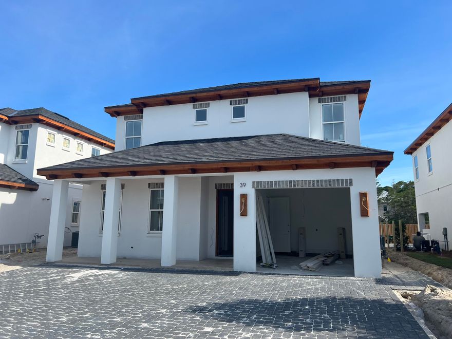 This beautiful New 4 bedroom house has tons of upgrades. 1 car garage, hardwood and tile floors, custom tile shower, standing soaker tub, shiplap on the walls, custom tile showers, 66in Fridge/Freezer, stainless steel appliances, Gas Navien tankless water heater. 2 Living rooms, Bunk Room , Fabulous Balcony. Private pool outdoor kitchen area. This is a 10 home subdivision just minutes away from the beach and near Gulf Place Center, great restaurants, shops, and golf.