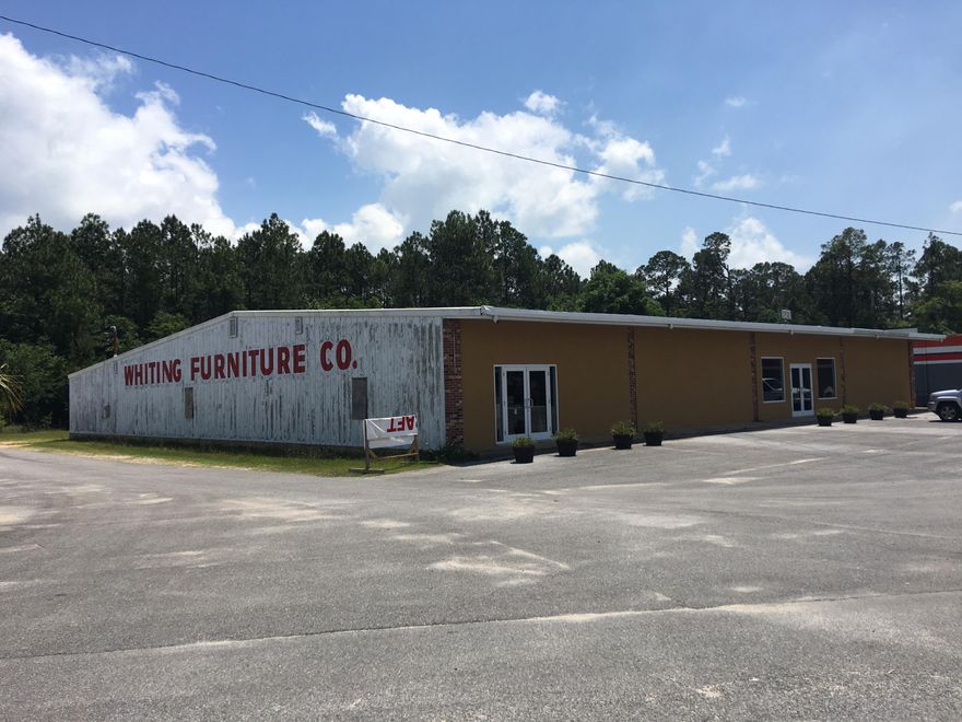 The former Whiting Furniture building is an 11,016 +/- SF stand alone commercial warehouse building positioned on 1.236 +/- AC. Warehouse is clear span/steel frame.Two parcels 091N2800000281000 & 091N2800000280000 combined total 1.236 +/- acres with 190.01 FT of frontage on Hwy 90.Located on primary travel corridor in Milton, FL. Milton is the county seat of Santa Rosa County and is located in the Pensacola Metropolitan Area. Santa Rosa County is one of the fastest growing counties in FL.