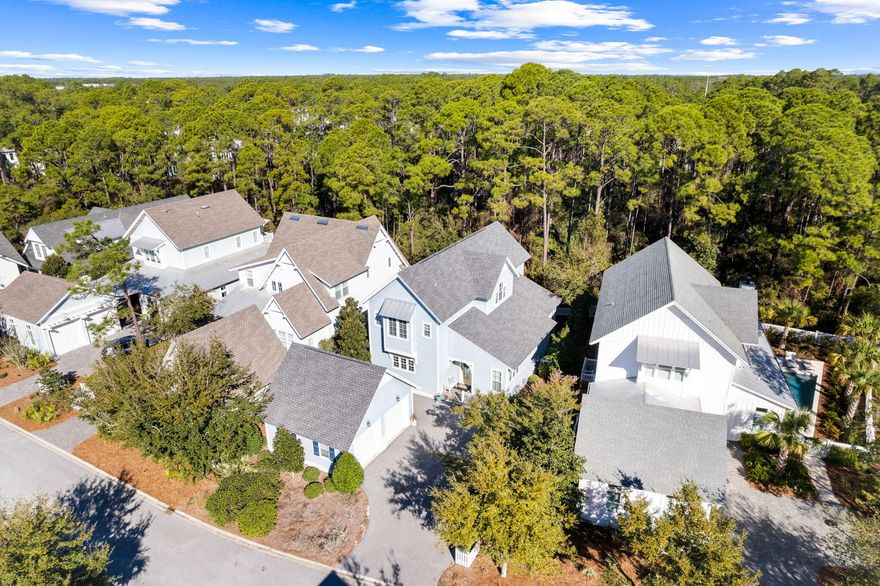 Located in an exclusive gated community,22 Sextant Lane offers premier access to the lifestyle and amenities of the Watersound West neighborhood. Backing up to the state park, this property provides an unparalleled approach to the natural resources, sugar white sands and emerald waters of 30A's coastal beaches. Siituated alongside the state park and boasting a private beach for the neighborhood residents, the access to the emerald waters is one of the most unique on 30A. The coastal design features an expansive  living space that seamlessly connects the kitchen, dining area, and living room. The Chef's kitchen showcases an oversized island and luxury appliances. Step outside and an outdoor living area highlighted by a relaxing screened-in porch. The primary suite,
 found on the main level, presents an extravagant bathroom adorned with a double vanity, a custom-tiled shower, complete with a walk-in closet. An office or "bunk room" alongside a full
 bath and laundry room completes the main floor. Up the stairs, you will find three additional bedrooms, complete with two full baths as well as an additional sitting area. Hardwood flooring is situated throughout the house which really completes the coastal
 look of the perfect beach home. Watersound West Beach is located in the highly sought after east end of 30A. Amenities include a large resort pool, walking trails and deeded beach access. 

