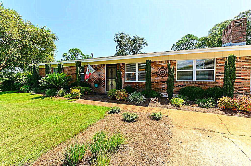 Over 300 sqft FLORIDA ROOM NOT REFLECTED IN SQ FT! OVER 1500 sq ft Home!! Beautifully renovated 3 Bedroom 2 Bath Home in established central Ft. Walton Beach! One of the select areas with a neighborhood park! New Modern Renovations! Kitchen offers great space, tile floors, granite counters, oak cabinets, matching appliances & sunlit charming breakfast room! Beautiful dining area can also be used for 2nd living area or office. You will love the pleasantly cozy living space, wood burning fireplace, and of course the entertaining florida room! Interior features also include Natural Gas Water & Electric, New modern doors, fixtures, crown molding, double pane vinyl windows & modern paint. Exterior Features include sprinkler system, beautiful landscaping both front and back yard, Large Yard building, Lavish Very well cared for corner lot, gas line for Grill, fenced back yard & parking sufficient for RV & Boat! Just minutes to our beautiful beaches & shopping! Set your appointment by calling today!