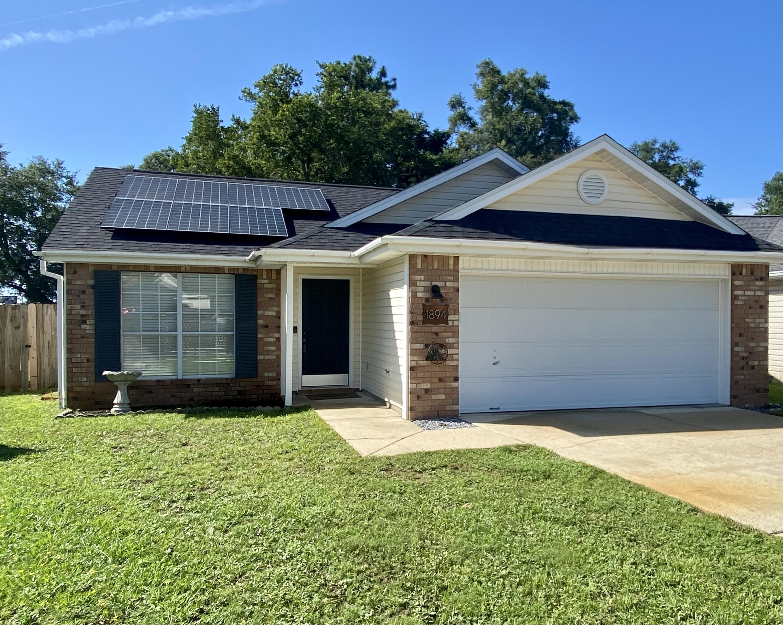 You can't find a better layout for the size of this home. 3 bedrooms & 2 full bathrooms; plus a 2 car garage. Convenient location to both Hurlburt Field AFB and Eglin AFB. Solar Panels to be paid off by seller.  New owners will enjoy an avg monthly electric bill of only $15!  (avg electric bill was $175)  Open & spacious kitchen with walk-in pantry,  wrap around raised breakfast bar, tile floors and ample dining space.  Stainless steel appliances new in 2020.  High vaulted ceiling in kitchen and family room. Plenty of natural light throughout. Master bedroom suite has not one but two deep closets. Large master bath with double sink vanity and garden tub/shower combo. Interior laundry room.  BIG backyard perfect for kids, dogs, or adding a pool. Roof 2019. Water heater 2020.