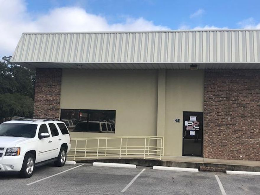 Versatile Flex Warehouse Space with approximately 1,000 sqft of heated and cooled office space, and reception / P.O.S. area, 2 ADA bathrooms, and 2,362 sqft of distribution warehouse space with loading dock and 14 ft. high roll up door.