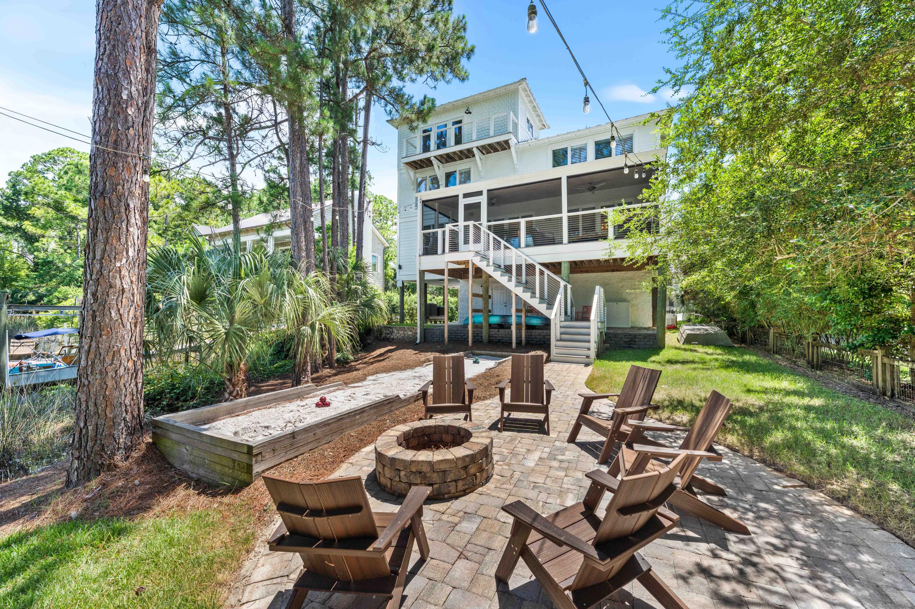 Perched on the peaceful waters of Eastern Lake with panoramic views extending to the Gulf waters, 105 Trae Lane is a true sanctuary with four bedrooms, four bathrooms, and 3,525 square feet of meticulously curated interiors. Spanning four levels featuring elevated craftsmanship, this exceptional residence was completely reimagined in 2022 and offers a rare combination of privacy, waterfront views, and modern sophistication.Inside, no detail has been overlooked. A chef's kitchen is outfitted with top-of-the-line Sub-Zero and Wolf appliances, dual dishwashers, and two ice makers--one is commercial-grade making entertaining effortless. Custom cabinetry with integrated lighting enhances every corner of the home, while other premium features add the touches of coastal creativity. creativity.
The home's layout includes multiple living spaces and an expansive screened porch, all thoughtfully oriented to maximize views and natural light. Motorized power blinds for the windows on the main level, 100% LED lighting, and two new A/C and furnace units ensure year-round comfort, while a standby natural gas generator, tankless water heater, and state-of-the-art camera and alarm system provide peace of mind.
With two washers and dryers, two climate-controlled garages with additional storage, and thoughtful touches throughout, the home is perfectly equipped for effortless everyday living or multigenerational escapes. This meticulously maintained residence has had only two owners, has never been rented, and remains in pristine condition.
Outdoors, the lifestyle continues with a private boat dock, featuring a covered 5,000-lb boat lift and floating dock ideal for launching kayaks and paddleboards directly into Eastern Lake. From there, cruise straight to the Gulf or explore the serene natural surroundings this unique lakefront location affords.
