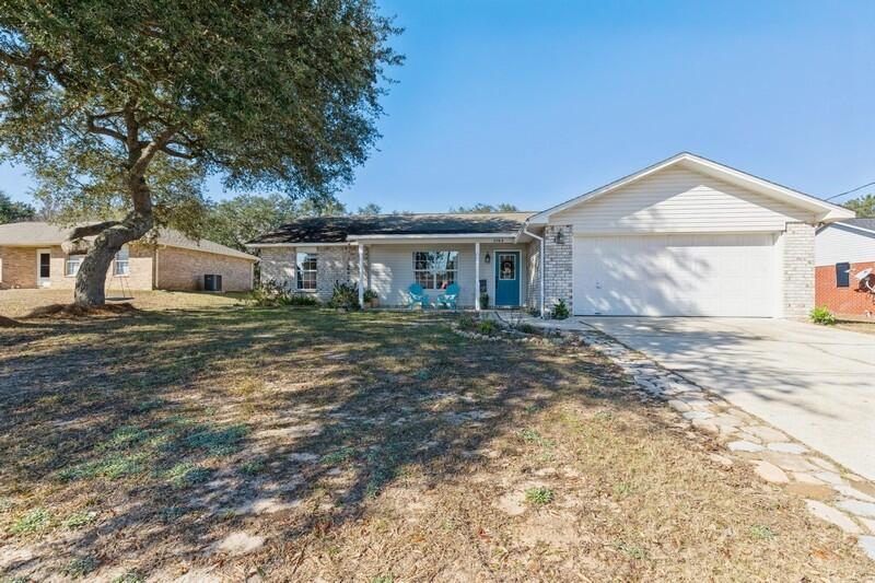 UPDATED, ADORABLE 3/2 on large .33 acre lot on quiet cul-de-sac surrounded by mature trees providing ample shade. Open concept floorplan featuring luxury vinyl plank flooring throughout, vaulted ceilings in the spacious living room. Stylish light fixtures, recessed lighting, highly desired above sink kitchen window that over looks the backyard, upgraded stainless steel appliances, plentiful counter space, ample white cabinetry and large eating area. Oversized master bdrm w walk in closet & custom shelving, large master bath with spa like upgrades makes this a true owners retreat. indoor laundry room, 2 car garage. large backyard offers a space for fire pit, swing set, raised garden beds and an area for chicken coop! This home is ready to welcome all family members! Do NOT miss out