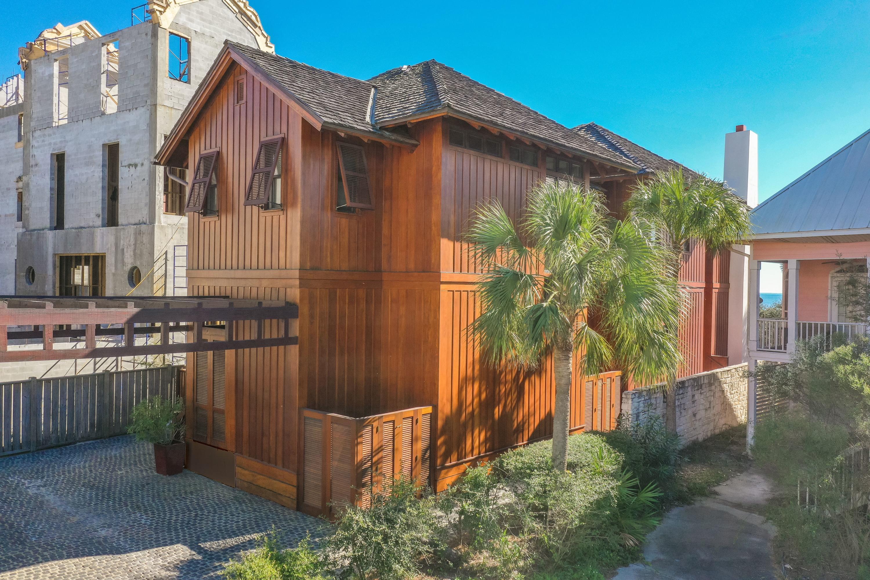 Experience mesmerizing views from this 3,880-square-foot, pure mahogany, gulf-front home nestled atop the dunes in Seagrove, Florida. Offering 12-foot ceilings on both the upper and lower levels of the property, the grandeur of this Architect Tom Christ-designed masterpiece is further accented by a mixture of basalt and mahogany flooring showcased throughout.A spacious kitchen offers a delightful area to cook and gather thanks to handmade flooring tiles, limestone walls and soapstone countertops. A walk-in pantry provides plentiful storage, while the culinary-minded will delight over the 60' Wolf range, Sub-Zero refrigerator, doubledishwashers and two Sub-Zero wine chillers.An expansive living/dining space is accented by flanking limestone fireplaces on each side,offering warmth and