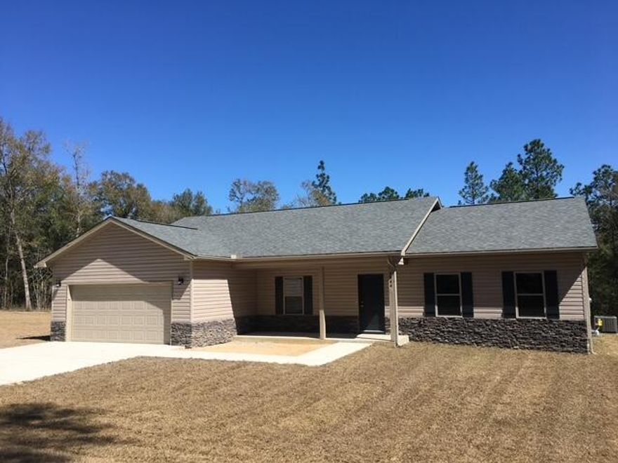 Southern Traditional brick home on 4 acres in Holt! Built in 2020, this 3BR/2BA offers ~1,959 SF with a spacious, open floor plan, high ceilings, and great natural light. The kitchen features custom cabinetry and a functional layout that flows easily into the main living and dining areas--perfect for everyday living and entertaining. Enjoy acreage living with a barn/workshop 24x36, 1/3 enclosed, 1/3 screened 1/3 open but covered--ideal for storage, hobbies, equipment, or outdoor relaxing. There is a 12x24 pad on with an RV 50amp electrical box. Plenty of room for parking and land use options. Convenient to major routes for commuting. Professional pictures to be done soon. All information in the MLS is intended to be accurate, but cannot be guaranteed. Buyers are to do their due diligence.