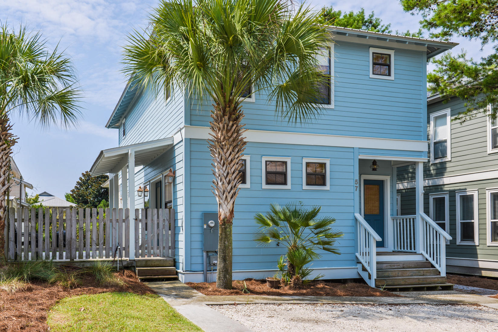 Welcome to the Barefoot Bungalow, SOUTH OF 30A in BLUE MOUNTAIN BEACH!!! Home offers 3 bedrooms plus office and 2.5 baths. Move-in condition with beautiful hard wood floors throughout the living space and stairs, carpet only in bedrooms and office. Kitchen has stainless appliances and granite counters. Upstairs you will find the remodeled master bath with travertine floors and shower. The windows all have Bamboo window treatments and linen, grommet-topped curtains in the master plus entry-living-dining area. Outside is 17X9 wooden deck, a fenced in yard, GRASS and an 8X16 storage shed. New hot water heater in 2012 and blown insulation under home as well. New A/C March 2015. Easy access parking for 2+ vehicles. The exterior of the home was painted in April of 2014. NO HOA FEES.