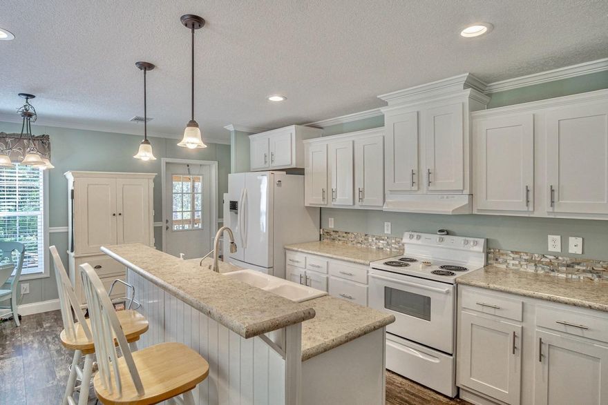 Well maintained manufactured home surrounded by nature. Large living area and kitchen, laundry room is located off the kitchen with washer and dryer, has plenty of space for storage or can be used as a pantry. Three spacious bedrooms with large closets. Master bedroom has walk-in closet, his and her sinks, master bath with garden tub and walk in shower. Large screened in porch to enjoy the beauty of the outdoors.