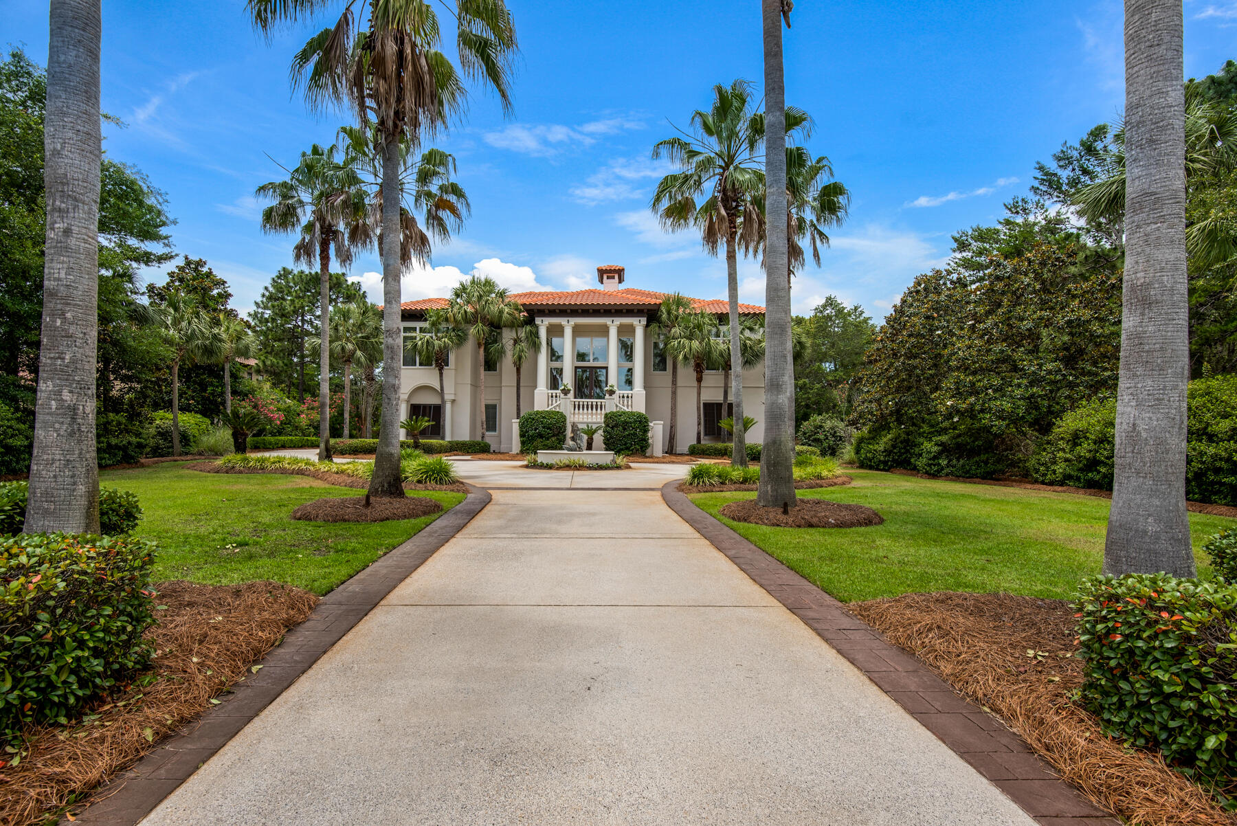 Exceptional grandeur and craftsmanship in this beautiful Burnt Pine home. If you are looking for curb appeal, you have found it. The lush manicured lawns with the sweeping circular drive has 25 enormous palm trees that welcome you into the half acre property that allow you to see golfers hitting their tee shot into the sunset on hole # 5 on Burnt Pine Golf Course. Do this while drinking your favorite beverage and watching the sunset over the water from your 400 sq. ft of screened in entertainment space from the main deck. If you are wanting privacy, this is your place. Hide away on the end of the last cul-de-sac in the subdivision to feel like you are a million miles away from the mainstream but only a golf cart ride from the Marina, Baytown Wharf, Grand Blvd and the Gulf.