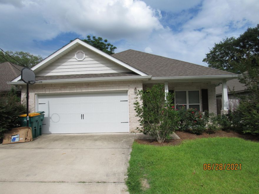 Available July 19! Gorgeous all-brick, 4 bedroom, 2 bath 2018 built home located in central Niceville with an easy commute to bases, beaches, schools, shopping, and more, this one features a highly desirable open, split floor plan with tons of upgrades and gorgeous finishes! Some of the custom, modern touches throughout include 9-11 foot ceilings (tray ceilings in the living room and master), crown molding, arched doorways, vinyl plank/tile flooring, and updated light fixtures. The eat-in kitchen will dazzle you with quartz counter-tops, custom, soft-close, shaker style, all-wood cabinets, slate appliances, a large walk-in pantry, and a large island complete with a breakfast bar (and a separate, second, formal dining area, as well).  Off of the spacious living room, souble doors lead to a covered back porch overlooking the privacy-fenced back yard. The primary bedroom is massive and has a huge walk-in closet as well as its own en suite, complete with a glass door, tiled, walk-in shower and double vanity. The other three nicely sized bedrooms share a full guest bath, as well. The 2-car garage is off of the laundry room. Pets may be considered on a case-by-case basis with prior owner approval and a non-refundable pet fee. No smoking, including vapes.