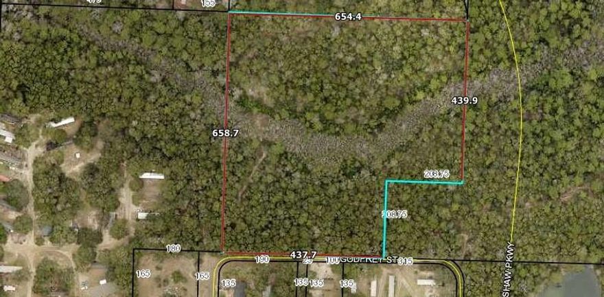 'BACK-UP Offers being considered.'Zoned Industrial I-2. due to the Airport.  There is access from Foy Shaw Pkwy in the NE corner.  Looking for a place to hide out among nature on this 8.94 AC parcel close to the heart of Crestview.  Tucked away from it all.   Most of this property is in Flood zone X however, there is a portion in Flood Zone A.  . This parcel is unimproved, no survey, No owner financing available.  Utilities are available in the area. Buyer and buyer's agent to verify all information.
