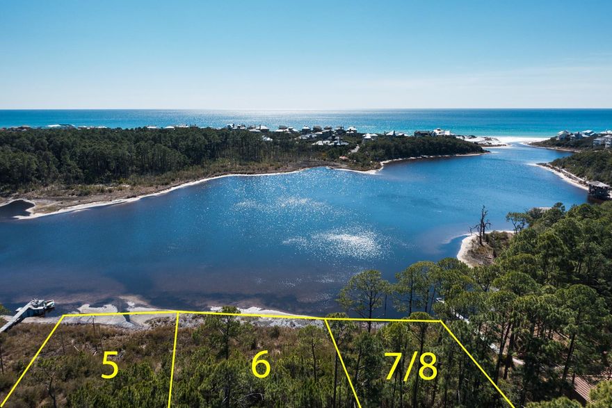 UNIQUE & RARE! Quaint lakefront community, south of 30a, with sensational Gulf of Mexico views & Draper Lake frontage. Home site is huge  one quarter acre, 400' deep & 80' wide! Underground utilities, natural gas and water/sewer tap fees are paid. Boat docks are permitted for easy beach access