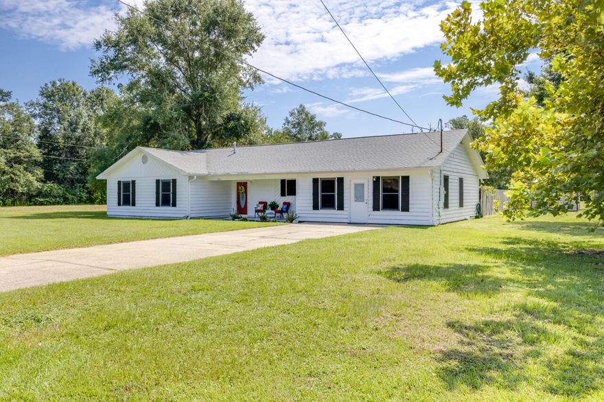 This home with three bedrooms and two and a half bathrooms features a bonus room that has its own entrance, a cozy fireplace in the living area, a covered back porch as well as a separate building in the backyard. The home sits on 1.38 acres with yard space for outdoor activities.  Call today for a showing.