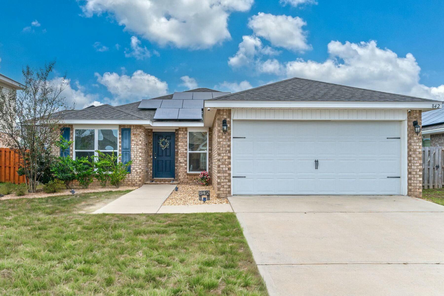 Welcome home to the Alpine floor plan featuring 3 bedrooms, 2 baths, covered front porch & 2 car garage. The open kitchen has stainless appliances and granite countertops. The kitchen opens to the family room w/ access to the back patio. The master suite is just off the back side of the house & master bath features a walk in closet and dual sinks. Owners have upgraded the bathrooms to granite, added new light fixtures, installed a hammock to relax in the backyard and even painted. Smart home with cameras, Nest thermostat and solar panels to be paid off at closing. Enjoy the communities amenities while close to the base and schools.