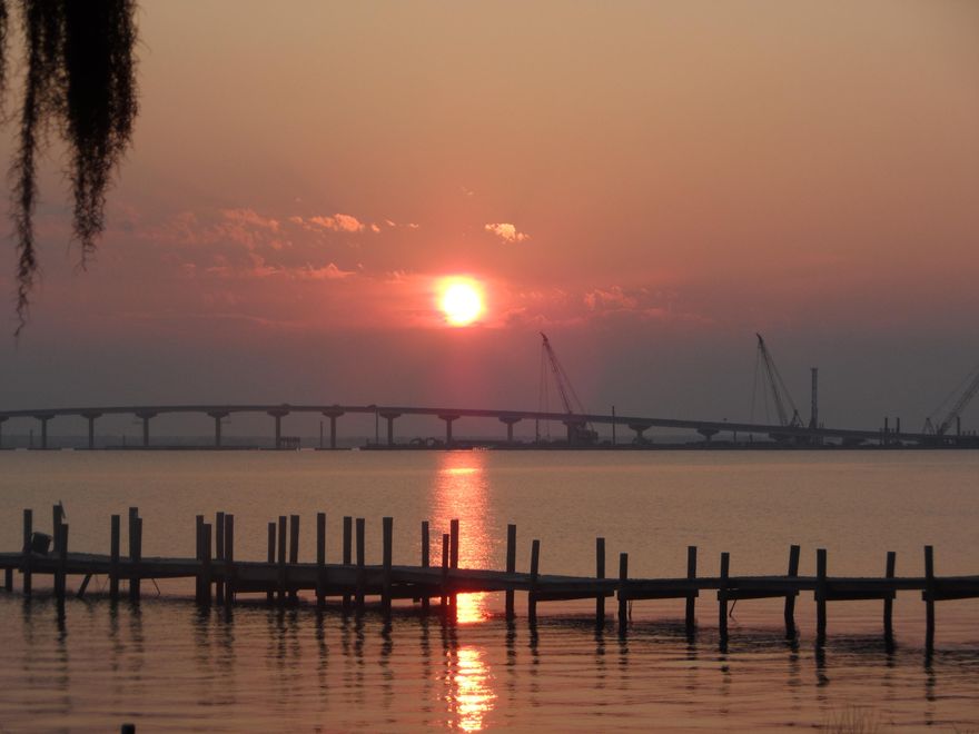 This is a awesome home that is on the bay. 2 bed/1.5 bath single home that has been totally remodeled inside and out. It looks like brand new inside. It has a 24x12 screened in porch could be split and easily made into another bedroom. It has great views from every room. It is just the perfect place on the bay. It has all new cabinets, New bathrooms, tile, paint. You can swim, Fish, Crab. Sit on your porch and have your own dolphin show. Watch the boats. Views of the sunrise and sunset. It is breath taking. So private back in here you can not believe it. Pets ok. verify schools please and any other information that is important to you. HOA 300 yr. Room to add on to back. owner sister to Agent This home has a 1/2 bath,screened in porch, larger lot than the other homes