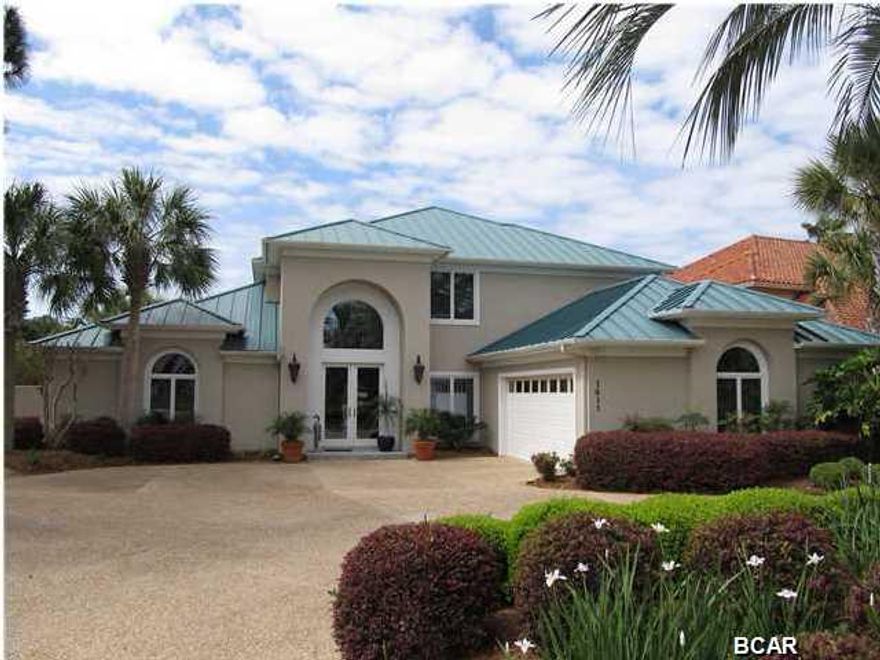 SELLER SAYS ''SELL THIS HOME''! New Paint! Every room of this One Owner - Custom Built home has just been painted and it is Move in Ready! Gorgeous 4 Bedroom/4 Bath home on the canal in Bay Point! This is a must see home with 75 feet on the Bay Point Canal. The floor plan is welcoming and open, with lots of natural light. A well built home with all the upgrades! A wonderful family home! You will love the spacious rooms, hardwood floors, fantastic open kitchen, screened in porch, and large patio with POOL.The over sized master bedroom is on first level for easy living. The master bedroom opens to the pool deck and has a sitting area and spacious his and hers bath - literally 2 of everything except for the whirlpool bath! 2nd level has 3 bedrooms and 2 additional bathrooms as well as a huge