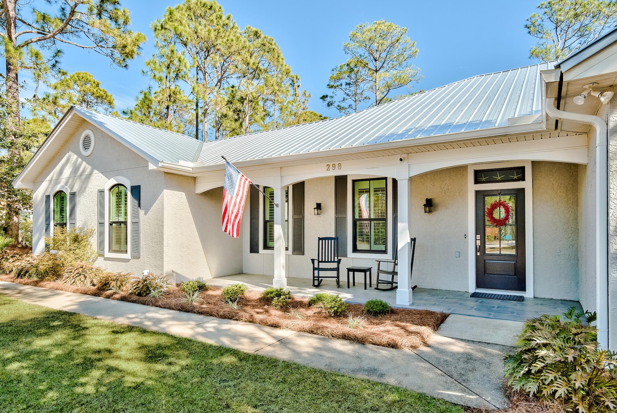 Experience single-level living on 30A in the coveted community of Sugarwood Beach. This meticulously remodeled beach retreat sits on the largest usable lot in the neighborhood. The backyard is a private sanctuary with a park-like atmosphere & saline, heated pool with smart controls. An exterior, private, open-air full bath adds a sense of luxury & ease. The beautiful Pergola & paved patio lead inside through the screened entertainment porch. Windows & doors are impact rated, added in 2020, along with the metal roof. Upgrades are abundant. Enjoy zoned living with capability of privacy shutout for guest bedrooms & bath, while the Master Suite resides in its own wing. This is a rare opportunity for open, one-story living, with an extra-large preserve of Seagrove paradise out the back door.