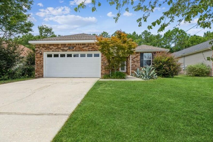 Welcome to Wildwood Gables located in central Crestview. This spacious 3 bedroom - 2 bathroom home has a beautiful brick front with vinyl on 3 sides. The home offers a split floor plan for privacy tat Buyers expect. Enjoy the all vaulted ceilings in the living room with fireplace and mantle that warm the home. The kitchen has all wood cabinets with refrigerator, smooth top range, microwave, dishwasher & disposal. A spacious tiled dining area is adjacent to the kitchen. Large master bedroom w/ trey ceiling and ensuite bathroom with double vanity & walk-in closet. The two additional bedroom are on the opposite side of the home separated by an additional full bathroom. Indoor laundry room next to the 2 car garage w/ pull down stairs and auto opener. Nicely landscaped front yard with a back yard that is a blank canvas for your entertaining. Fenced back yard, 12x12 cement patio for grilling and entertaining. Newer dimensional shingle roof with gutters in front. Newer AC has also been installed in the home. Don't miss out on this exceptional value. Schedule your showing today!