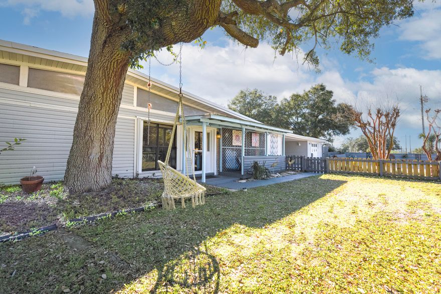 MULTI-GENERATIONAL HOME located in Fort Walton Beach, FL. Endless possibilities with this large 3 bedroom home with a mother in law suite and 2 lock out opportunities. This property would be perfect for a large family or someone looking for 3 mother-in-law suites. You will love the communal backyard that shares a large pool and outdoor space that can host considerable sized gatherings. This home is made for entertainment as there is plenty of space for everyone. The main home offers a sunken living room, a formal dining and informal dining space that overlooks the living room. The kitchen is open to an informal dining space and is equipped with a gas range.Just off the kitchen you will find a generous sized laundry room (indoor) a bathroom and a good-sized suite The covered side porch off the main home is the perfect place for some privacy. The porch is just off the formal dining room which makes easy access to the kitchen and living room; It's the perfect spot for your morning coffee or afternoon cocktails.
Studio #1 is connected to the main home but could be a lock out if needed.   It conveys as seen with a queen bed, a full bath, and a small dining area. This mini suite has its own private entrance and has access to the communal backyard and pool.
Studio #3 is true lockout complete with a queen bed and a kitchenette.
The communal backyard is the heart of the property featuring a large pool, grilling area, outdoor dining, poolside bar- what a great place to impress your guests!
The current owner has security cameras set up as an extra layer of peace of mind.
