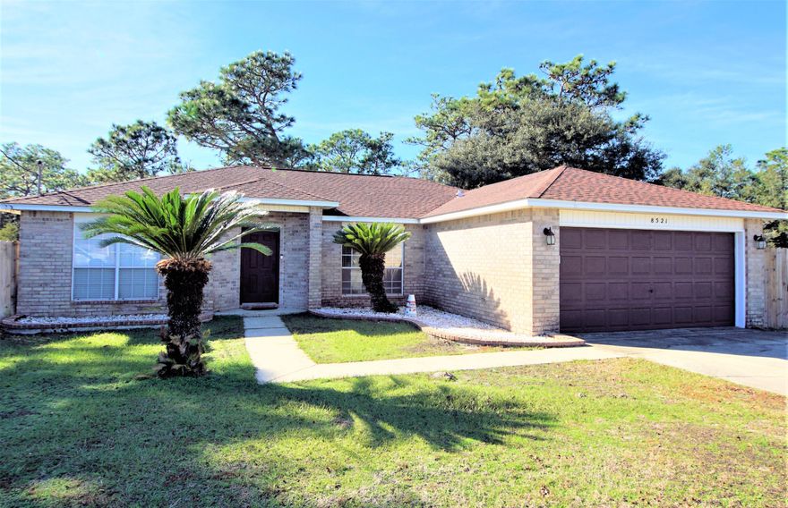 Convenient location with easy access and walking distance to high school. 1/2 acre lot, HUGE backyard with room for a pool, detached workshop or garage, boat or RV. Move in ready, freshly painted, and super cute. No carpet for those with allergies or pets - flooring is tile and laminate wood. The living area with vaulted ceiling is open to the kitchen and dining areas for easy conversations. The master bedroom is separate, with a huge master closet and tile walk in shower. To the right of the entry is an open room that could be used as a formal dining room, office, play room, or school area. Laundry room leads to the garage. Updated lighting, plumbing fixtures and sinks throughout. Remodeled master bath . Nest thermostat and Ring doorbell convey! Check out the fire pit and covered grilling area in the backyard. New fence gates. Security system. Roof permitted 2005, hot water heater 2018. LG Stainless French Door fridge 2017. Located on cul-de-sac with no through traffic, wooded behind the property for added privacy. Backyard is private. Located directly off the south end of Hwy. 87 with easy drive to Milton, Pensacola, Hurlburt and Eglin AFB. 