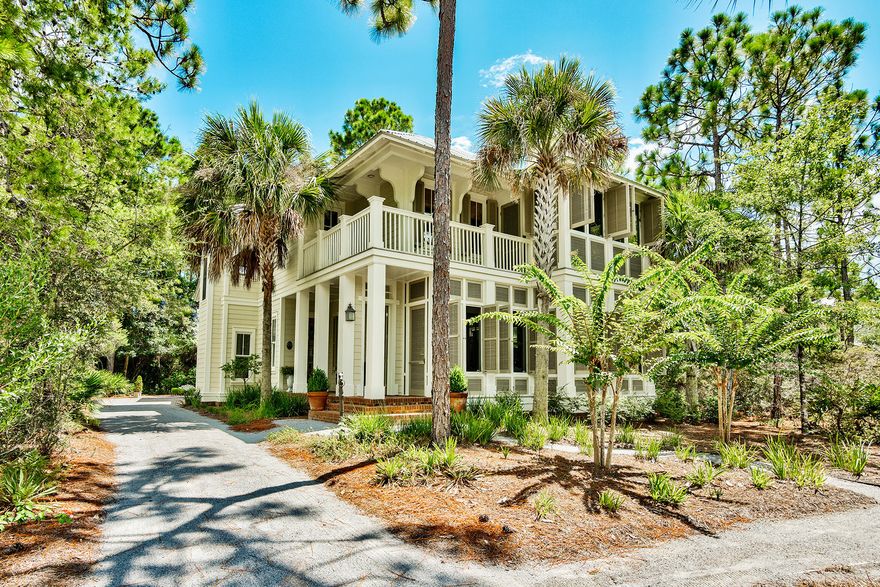 Charleston-inspired details like a welcoming piazza with gas fireplace, custom shutters, and herringbone-brick walkway create a picture-perfect coastal cottage. Walk into this charming home and you'll notice natural light streaming from multiple transom windows. The friendly, open kitchen features an eat-in dining counter where family and guests can gather while you cook or tend the wet bar that includes a wine refrigerator and icemaker. Additional guests can lounge in the ample living area, complete with a gas fireplace. Custom built-ins, featuring glass doors and recessed lighting, are featured throughout the dining area along with views of the lush backyard. The second floor features a spacious landing perfect for a home office. A large master includes an en-suite bathroom and sleepin