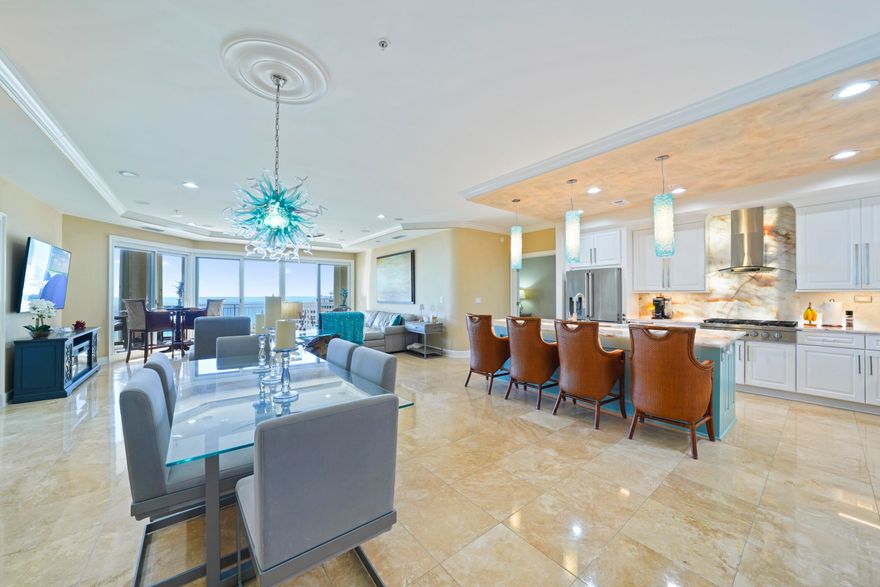 Experience the coastal lifestyle at its finest in this beautiful, rental-restricted 3 bedroom, 3 bathroom villa, perfectly situated in the heart of Miramar Beach. Offering 2,490 square feet of elegant living space with breathtaking views of the Gulf, this villa combines refined style with everyday comfort. Perched on the 6th floor of Grand Dunes II; enjoying the perspective of an 8th-floor elevation; the views are absolutely stunning. The villa conveys fully furnished and turnkey, ready for immediate enjoyment, and represents the largest 3-bedroom floor plan available in Grand Dunes II. The semi-private elevator opens directly into your private foyer, enhanced with motion-sensor lighting and a dazzling Swarovski crystal chandelier. From there, the open concept living area unfolds with floor to ceiling windows that flood the space with natural light and frame uninterrupted views of the emerald waters. Notable design features include soaring 9.5' ceilings, travertine flooring throughout main spaces, ceramic "faux" hardwood in bedrooms, custom variable LED lighting, solid wood interior doors, sound attenuated interiors for quiet comfort, and wiring for audio/visual systems.

One-of-a-kind and truly remarkable, this Kitchen showcases a rare and breathtaking 8.5' CRISTALITA QUARTZITE island and bar; an extraordinary natural stone prized for its translucent crystalline beauty. Under-lit with integrated LED lighting, the surface radiates a luminous glow, creating a dramatic effect that is simply impossible to capture in photos and must be experienced in person. The CRISTALITA QUARTZITE continues seamlessly into the backsplash, where dramatic backlighting creates a striking and unique effect. Surrounding this centerpiece, the chef's kitchen features top-of-the-line professional-grade stainless steel appliances, including a natural gas 6-burner cooktop. Custom cabinetry with soft-close drawers and pull-down shelving enhances both elegance and functionality, while hand-blown pendant lighting by a regional artisan and a masterfully faux-finished ceiling complete the blend of performance, luxury, and design.

The Gulf-front Primary Suite is a private retreat showcasing tray and coffered ceilings, a relaxing sitting area, dual walk-in closets, and a built-in safe. The Primary Bath offers new dual vanities topped with cascading ALEXANDRITA QUARTZITE waterfall countertops, paired with new sinks and modern hardware for a refined, spa-like feel. A doorless walk-in shower with multiple spray options and a jetted soaking tub surrounded in travertine create the perfect retreat for relaxation. LED mirrors and a sparkling crystal chandelier with retractable fan blades elevate the space with style, while a separate water closet with an ergonomic-height toilet adds both comfort and privacy.

In addition to the Primary Suite, the Gulf-front Guest Suite offers stunning views of the emerald waters, complemented by thermal-tint windows for added ease. Its updated bath features a custom ALEXANDRITA QUARTZITE banjo-style countertop with upgraded sink and fixtures, a contemporary LED mirror, a frameless glass shower with a multi-function showerhead, and an easy-access toilet.  

A second Guest Suite highlights elegant ceramic tile "faux" hardwood flooring, custom closets, and energy-efficient tinted windows for eco-friendly and relaxation. The en suite bath, which also serves as a powder room, offers a versatile multi-function showerhead, a modern LED mirror, and an elevated toilet for ease of use.  

A thoughtfully re-designed laundry room adds functionality with motion-sensor lighting, high-efficiency stacked washer/dryer, French-door refrigerator, quartz countertops, custom cabinetry, and a large utility sink. Both the HVAC and water heater have been replaced for peace of mind.  

The expansive Gulf-front balcony measuring more than 350 sq ft and an impressive 11 feet deep creates an outdoor living space perfectly tailored for relaxation or entertaining. It features a built-in natural gas Lynx grill, extended granite counter, stainless backsplash, beverage refrigerator, and all protected by "Hurricane" shutters. 

Grand Dunes offers: "Super Quiet Interiors", 24 hour security, gated entry, lush landscaping, 3 levels of gated underground parking for owners, grand lobby, semi-private elevators leading into your private foyer, private heated pool & hot tub, Owner's Lounge with Gulf front Fitness Room, Over-flow suites for guests, 200' of deeded beach, serene streams, majestic waterfall and a Lagoon Style Gulf front pool area with Hot Tub shared by both buildings and Beach Service.

Grand Dunes is the Emerald Coast's Most Desired Rental Restricted Beachfront Development!

Call us today to schedule your private viewing of this gorgeous Villa!