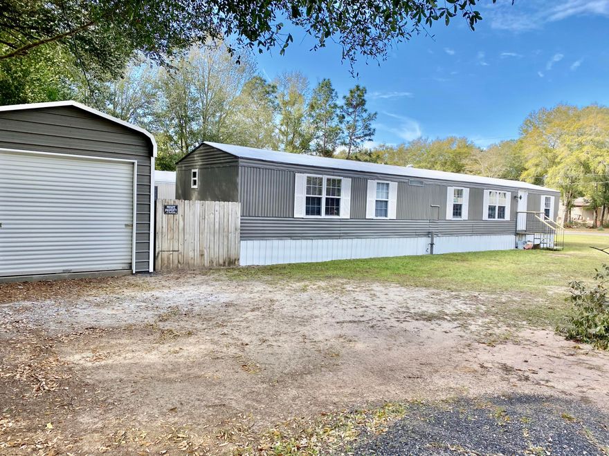 Welcome home to this beautiful 3 bedroom 2 bath Mobile Home centrally located to Hwy 90 and 30 minutes from Destin, Fl.  Love fishing or canoeing? This home is located less than 3 minutes from Shoal River that has boat launch  for canoeing or fishing.  This home has had updates including new LVP flooring in all rooms, new paint on interior and exterior, new wood cabinets and countertops installed 4 years ago, roof has been recoated and 12x16 detached garage.  Located on a corner lot for easy accessibility.   Make this your vacation home, first home or utilize as income producing property. Buyer to verify all areas of importance including lot size, room sizes, zoning.