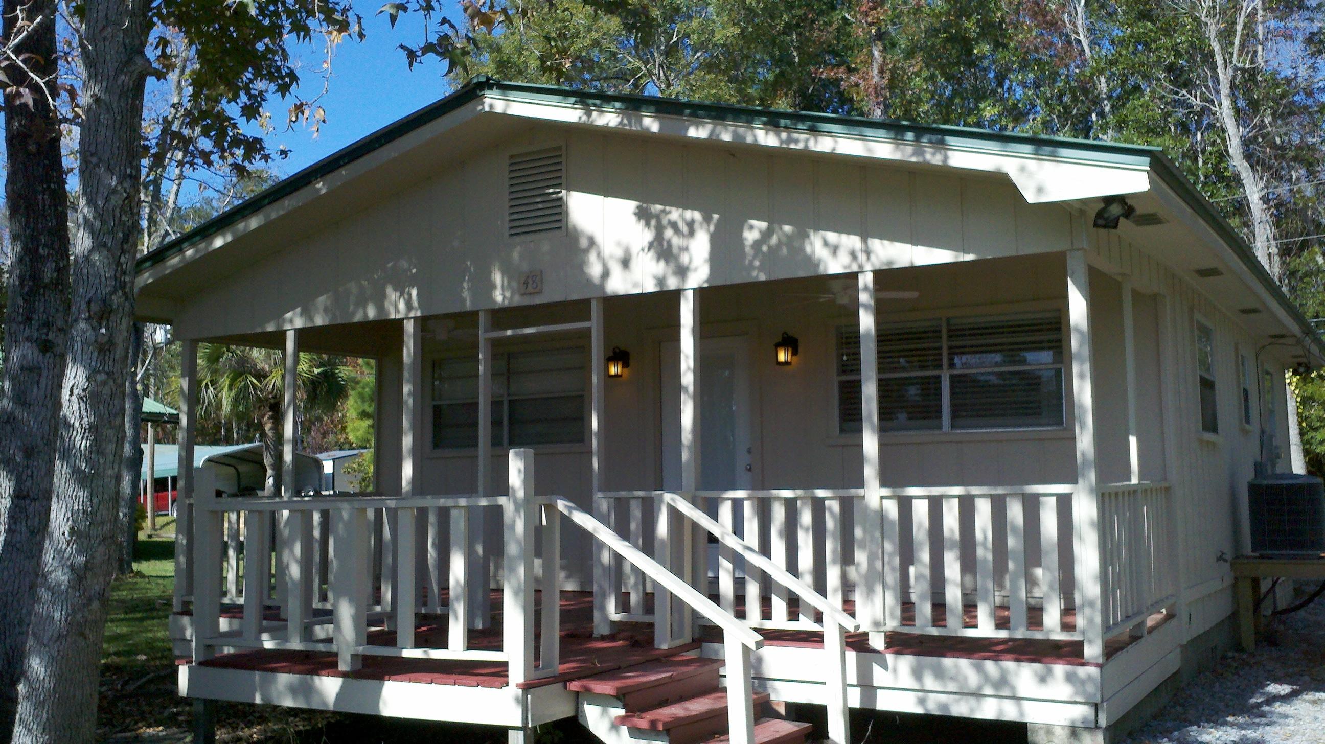 SELLER MOTIVATED - REDUCED PRICE!! Popular Black Creek Lodge Canalfront Cabin! Enjoy the waters & fishing of the local Rivers, Bay & Bayous! Cabin has been updated and is ideal for a weekend get-a-way! Unique woodwork & wainscoting, new tile & carpet floors, new bathroom, recessed lights, new fixtures and more! Fresh & modern with a Seaside flair! Front porch overlooks canal and view into Black Creek. Must see - this is a keeper!