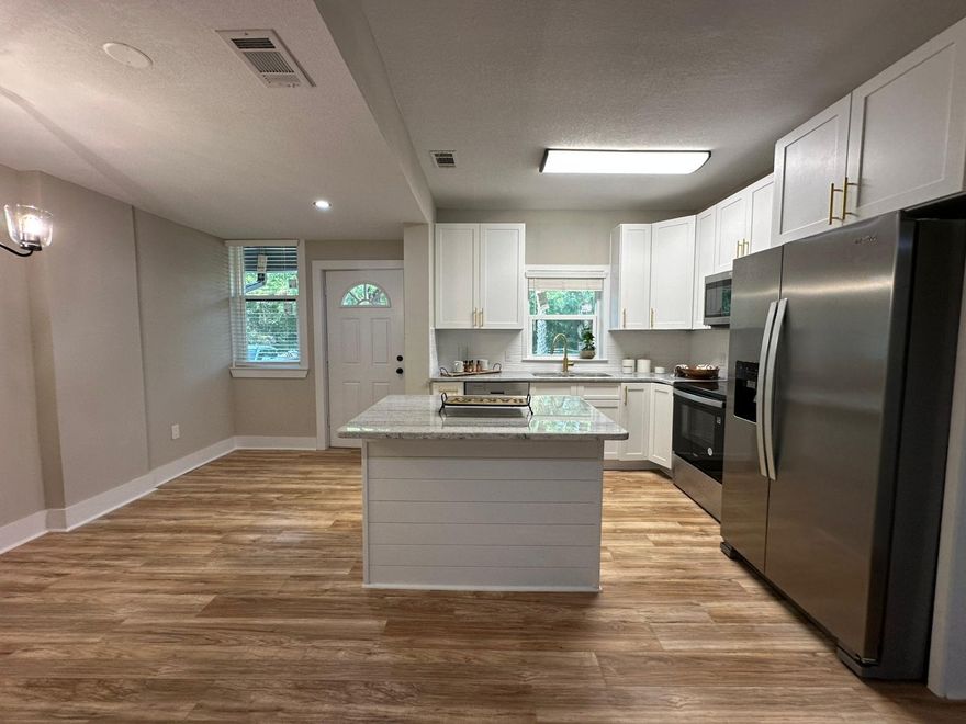 Fully Renovated Home - Move-In Ready! house 3/2 and Apt 1/1 This stunning home has been completely updated, featuring brand-new wiring, a new roof, and all-new windows for modern comfort and efficiency. Step into a gorgeous new kitchen with a spacious island, granite countertops, and stainless steel appliances, perfect for cooking and entertaining Enjoy freshly textured ceilings and walls, new paint inside and out, and upgraded fans and lighting throughout. The bathrooms have been fully remodeled for a sleek, contemporary feel.Don't miss this beautifully updated home--schedule your viewing today!210k in rehab spent..