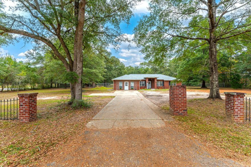 Need space? Then this beautiful 3/2 home is just what you've been looking for! Just minutes from down town Milton & 4 miles to Whiting Field!  The kitchen has a breakfast nook with windows overlooking the expansive property & has just been redone with quartz countertops and custom cabinets. Vaulted ceilings with architectural plant ledges plus a fireplace in the living room are just a few of the great things about this home. The master bedroom has a tray ceiling and his and her closets in the master bath. Double garage has been converted into an office. Roof was replaced in October, 2021, Septic lines October 2023 & the AC has been very well maintained. The backyard is simply stunning with so much room for dogs or even a small pony! Make your appointment today, your new home awaits you!