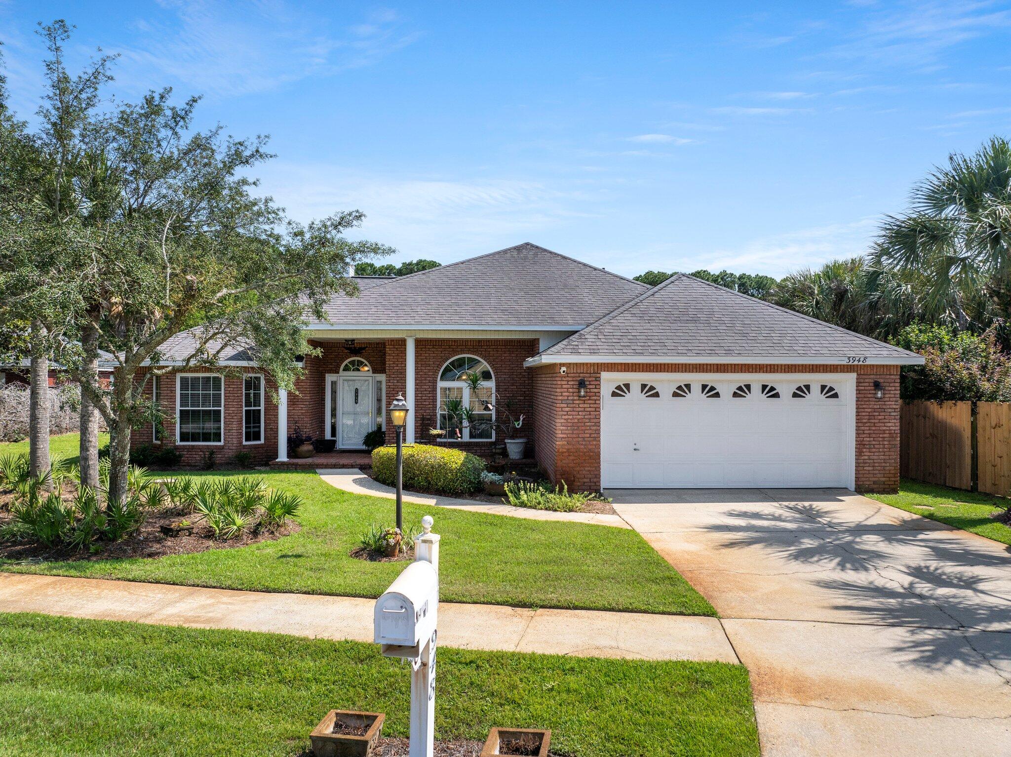 Welcome to 3948 Mesa Road nestled along the serene shores of Choctawhatchee Bay. This beautiful 3-bedroom, 4-sided brick home exudes charm and character, boasting stunning curb appeal framed by mature trees and lush, verdant grass. Step inside to discover a haven of comfort and style, where newer LVP flooring graces the kitchen and living areas, complemented by original wood floors in the inviting guest bedrooms.As you enter through the grand foyer, you're greeted by a cozy living space adorned with a rustic gas fireplace, perfect for chilly evenings and intimate gatherings. The renovated kitchen is a culinary delight, featuring an expansive breakfast bar, exquisite cabinets, and granite countertops, catering to both family meals