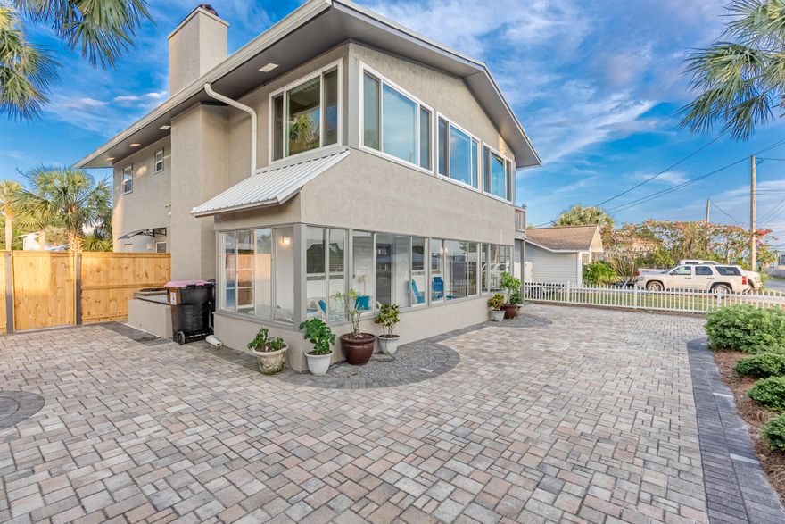 It's TIKI TIME!!  This home is all about LOCATION, LIFESTYLE and endless opportunities.  Enjoy amazing sunsets from the balcony with a peek-a-boo view of the Gulf or head done to the beach; which is one block away!!  Make this a primary home, second home, vacation or long term rental, live upstairs or downstairs and rent out the other.  There is a lock out to separate upstairs from downstairs or just live in the whole house.   Both upstairs and downstairs units have 2 bedroom, 1 bathroom, living, dining and kitchen.  The upstairs unit had a complete remodel down to the studs in 2010 replacing all electrical and plumbing (permit on file).  All AC units have been replaced from 2018 to 2020, new windows and media room doors 2020, exterior paint with Elastomeric paint for stucco 2020,