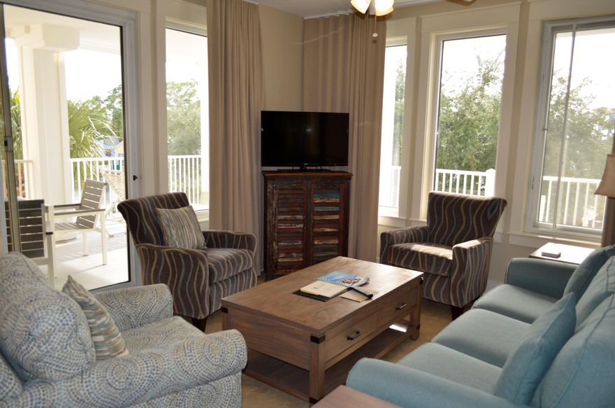 Completely updated, corner condo overlooking the Events Plaza in The Village of Baytowne Wharf! Low maintenance, gorgeous 18'' travertine flooring is seamlessly carried throughout the entry way, kitchen, breakfast bar, dining, living area, and both baths. Beautifully furnished with brand new contemporary beach style furnishings in the living area, dining, kitchen and balcony. Enjoy a split bedroom floor plan with both bedrooms having views of the Village. The master bedroom features an en-suite with a double sink vanity, walk in shower, and separate soaker tub. Floor to ceiling windows wrap around the living area inviting the natural light to come in. Enjoy spectacular fireworks shows, concerts, parades, and more right from your private balcony! Located on the same floor, you will be just