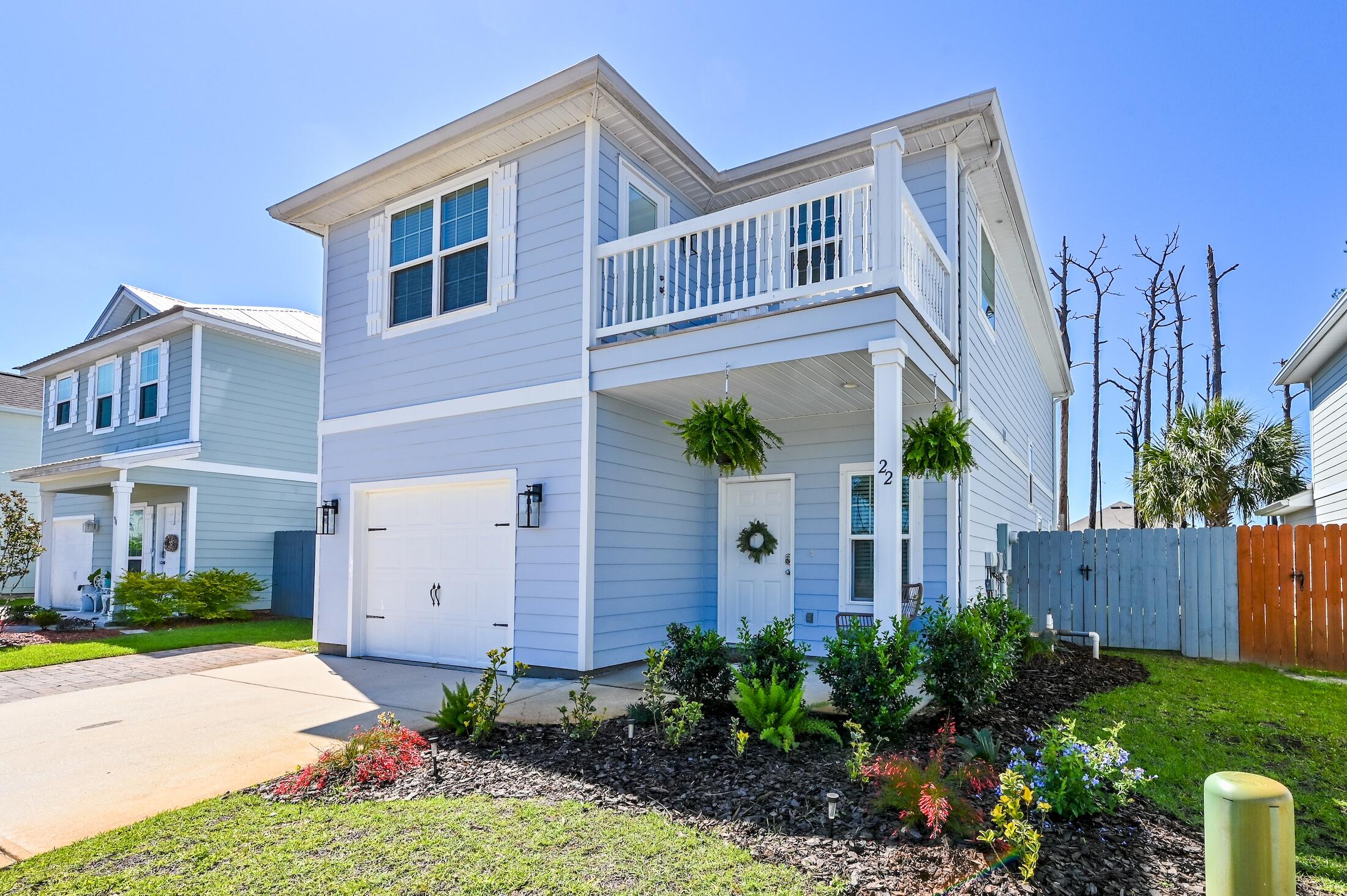 3 BR 2.5 BA 2 story home with garage located between the 30A Scenic Corridor and 98 South in Santa Rosa Beach and approximately 1 mile to the turquoise water and sugary white sand beaches. Bike to 30a from the bike trail at entrance of the community and enjoy all of the great bars/restaurants, and live music that abound. This is an excellent primary or secondary home with an open floor concept providing a great flow for entertaining from the large kitchen to the living room and separate dining room.  The home has been impeccably maintained with beautiful white oak Luxury Vinyl Plank, custom inlay tiles on the stairs and beautifully upgraded lighting throughout. The backyard dining and living area make for great entertaining while watching the sunset amongst the long leaf pine landscape.