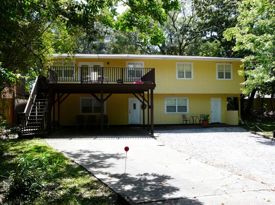 Great Duplex!! Live Up or Down - Lush yard!! Upstairs is 1352 sq ft with 3 bed/1 bath. Master bed has Sitting Rm. Full Kitchen with all appliances and washer/dryer-Living room/Dining room combo. Very nice !! And finished off with 20x20 deck upstairs!! Tenant has been there for awhile and very good. Downstairs is 890 sq ft 1 bedrm/1 bath with kitchenette and Living room Huge Master bed-room for daybed and King bed and more. Also has HUGE walk-in Master closet Downstairs and has a 22x5 storage room for Owners tools and personal items. Owners currently use Downstairs as their Beach retreat when they come to town. This can be your Beach Retreat and let the Upstairs Tenant pay the mortgage. Or rent both levels out. Roof-2004 AC-2006 Water Heater-2011, On cul-de-sac at end of 6th St. Perfect!!