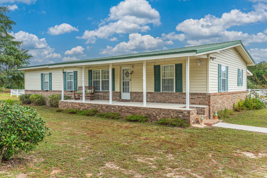 Situated on over 3 acres, this nicely maintained 3 bd/2 ba home features laminate hardwood flooring and an open floor plan. The spacious living boasts an electric fireplace with built ins on either side. Bright white cabinetry in kitchen w/ black/stainless steel appliances (island is movable and does not convey). Nice sized dining area will accommodate a large dining room table. Primary suite is spacious and has lots of natural light. Guest bedrooms are both a nice size. Rear Florida room is heated/cooled with a mini split unit and is a cozy space for relaxing. The backyard is complete with a 4 car garage/workshop space, in-ground swimming and a portion of the lot surrounding the pool features white vinyl picket fencing. Per the county, the parcel can be split. Please contact Planning